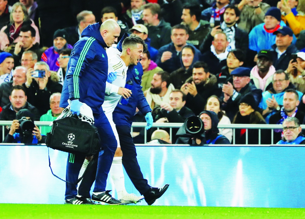 Real Madrid's Eden Hazard receives medical attention after sustaining an injury. Reuters/Susana Vera