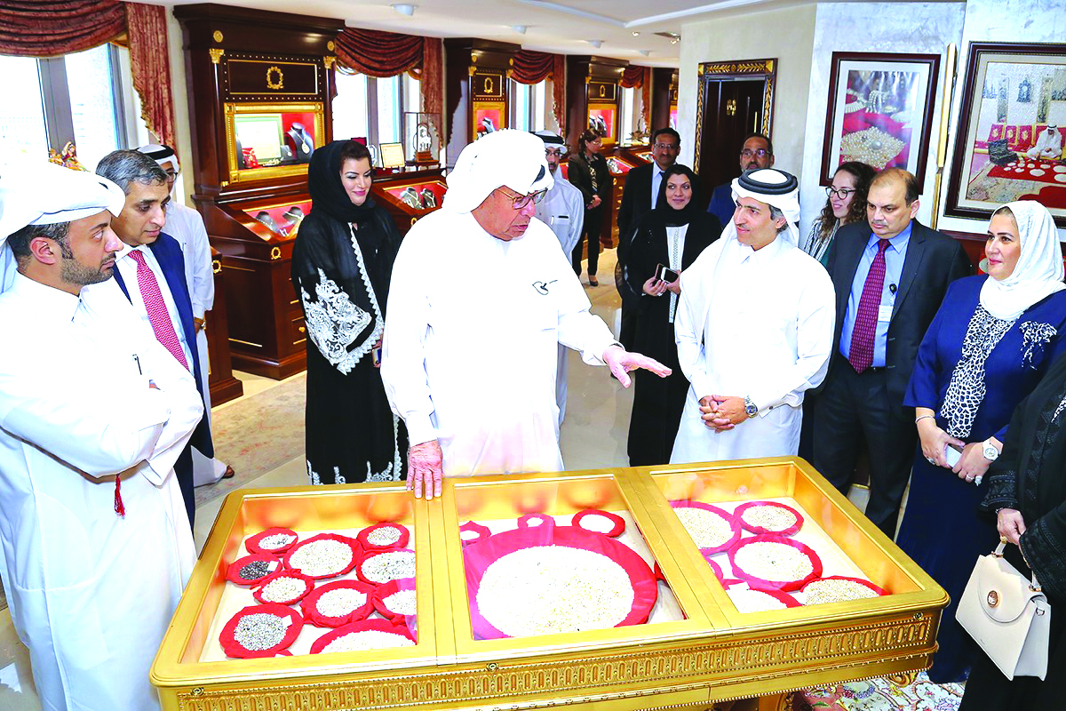 Hussain Al Fardan (centre), Board Member and  Vice-Chairman of Commercial Bank, narrating the story behind the rare jewellery collections to Commercial Bank’s valued customers at the gallery.