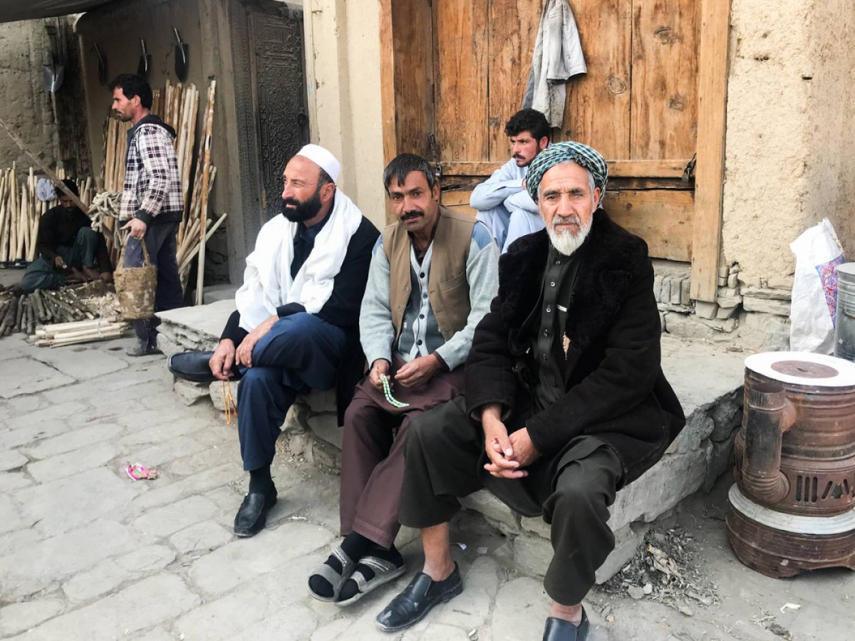 Residents sit in the historic neighbourhood of Murad Khani in Kabul's Old City, Afghanistan, on November  4 2019. Thomson Reuters Foundation/Rina Chandran