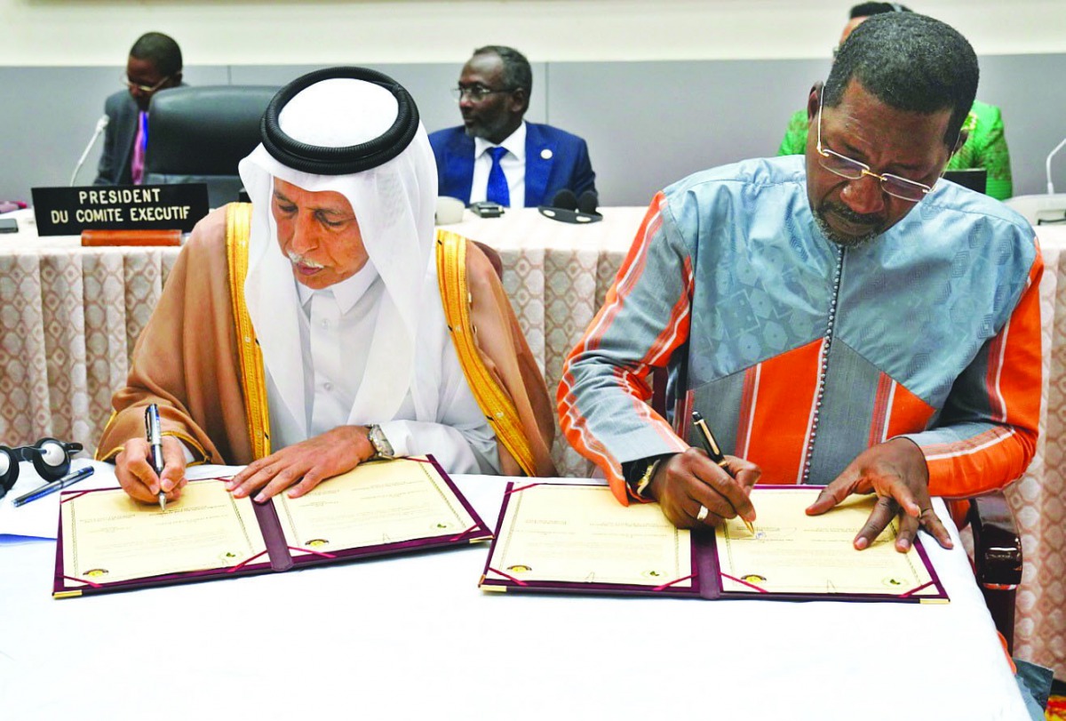 The Speaker of the Shura Council, H E Ahmed bin Abdullah bin Zaid Al Mahmoud, and the Chairperson of the Executive Committee of the African Parliamentary Union, Alassane Bala Sakande, signing the MoU.