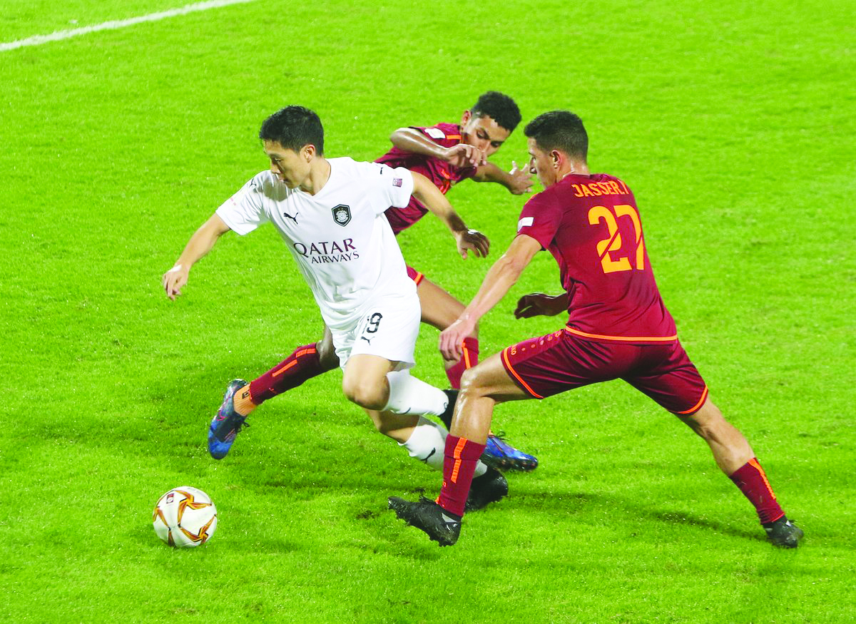 Al Sadd’s Nam Tae-Hee vies for the ball against two Al Shahaniya players at the Al Shamal Stadium yesterday. Picture: Twitter / @AlsaddSC 