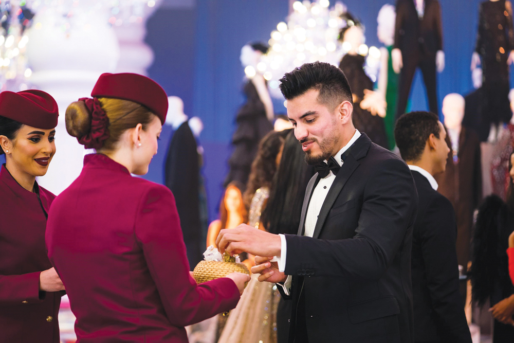 Cabin crew from Official Airline Partner Qatar Airways presenting guests with dates and coffee at the Grazia Style Awards. 
