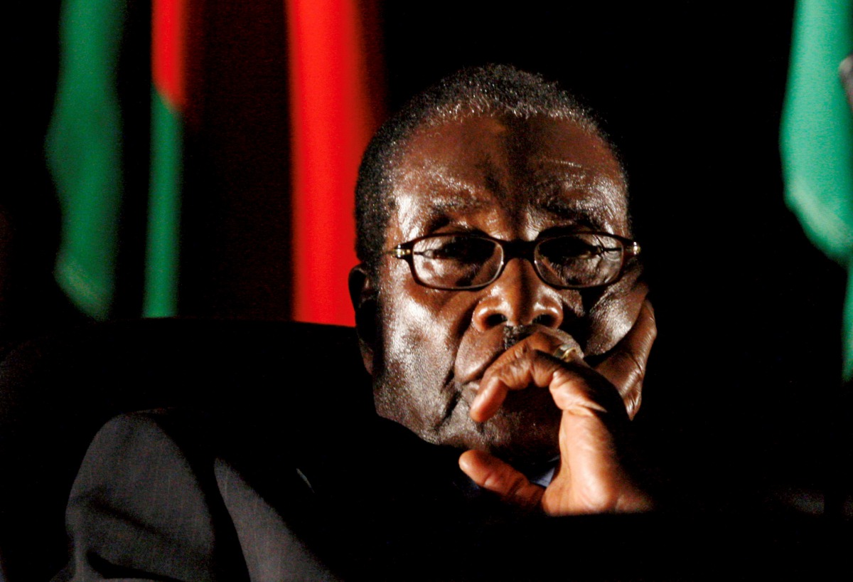 Robert Mugabe watches a video presentation during the summit of the Southern African Development Community in Johannesburg, August 17, 2008. Reuters / Mike Hutchings