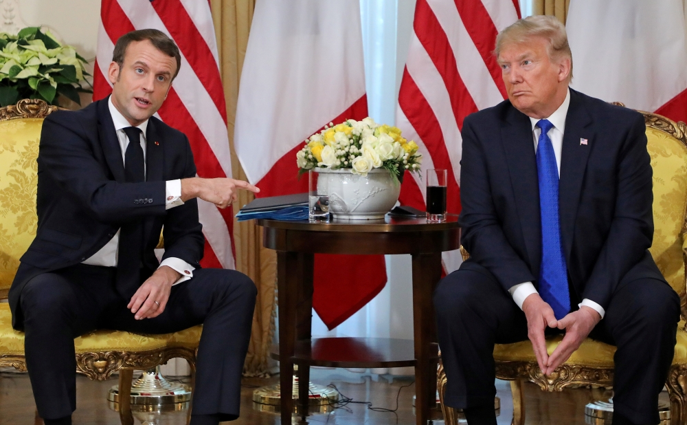 French President Emmanuel Macron gestures during the meeting with US President Donald Trump, ahead of the NATO summit in Watford, in London, Britain, December 3, 2019. Ludovic Marin/Pool via Reuters