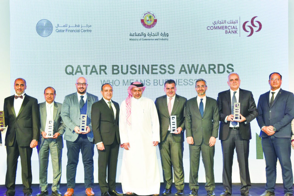 Yousuf Mohamed Al Jaida (centre), CEO, QFC; and Joseph Abraham (fourth left), Group CEO, Commercial Bank, with Haithem Katerji (fourth right), Chief Investment Officer, Al Rayan Investment;  Akber Khan (third right), Senior Director-Asset Management, Al R