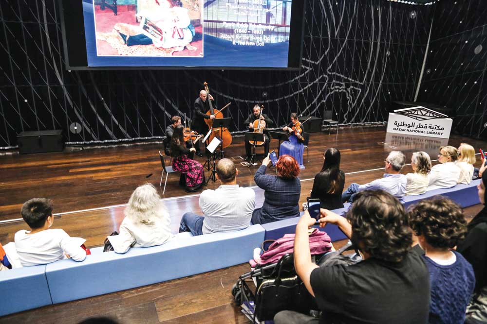 People enjoying Qatar Philharmonic Orchestra’s performance at QNL.