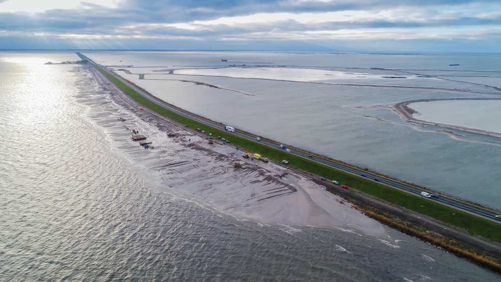 This handout aerial photograph taken on November 19, 2018, and made available by the Rijkswaterstaat (part of the Dutch Ministry of Infrastructure and the Environment) shows a view of the Houtribdijk near Enkhuizen, northern Netherlands, a major dike whic