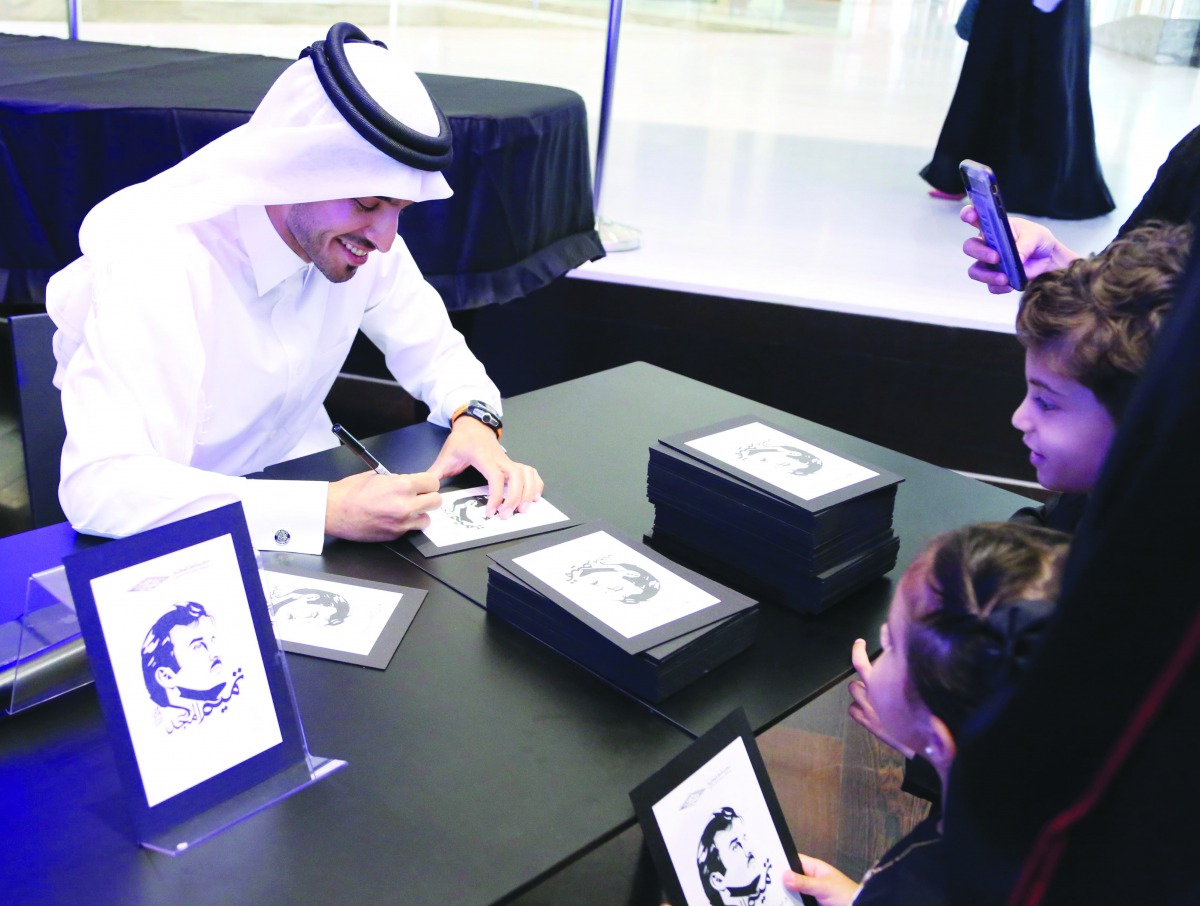 Qatari artist Ahmed Al Maadeed with visitors at QNL to mark the Qatar National Day.