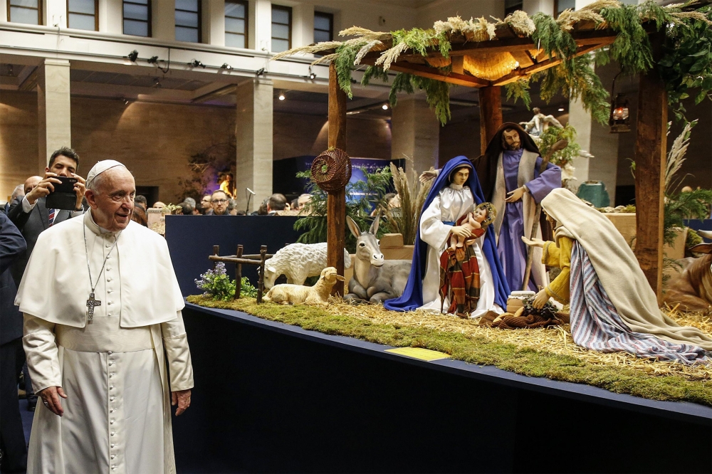 Pope Francis (Front L) visits the exhibition of the 