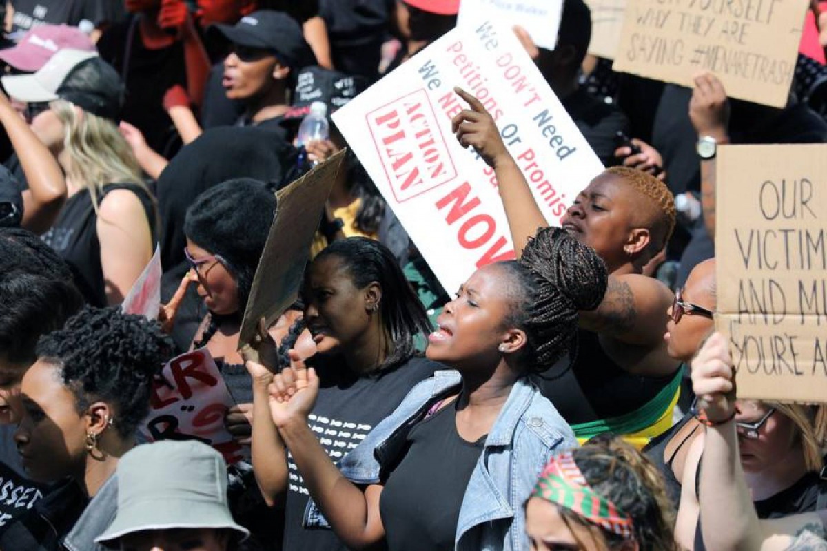 Women hold placards as they protest against gender-based violence, outside the Johannesburg Stock Exchange in Sandton, Johannesburg, South Africa, September 13, 2019. Reuters/Marius Bosch