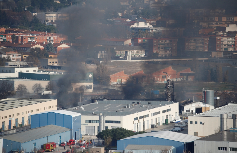 Smoke rises from a fire in a chemical plant outside of Barcelona, Spain December 11, 2019. REUTERS/Albert Gea