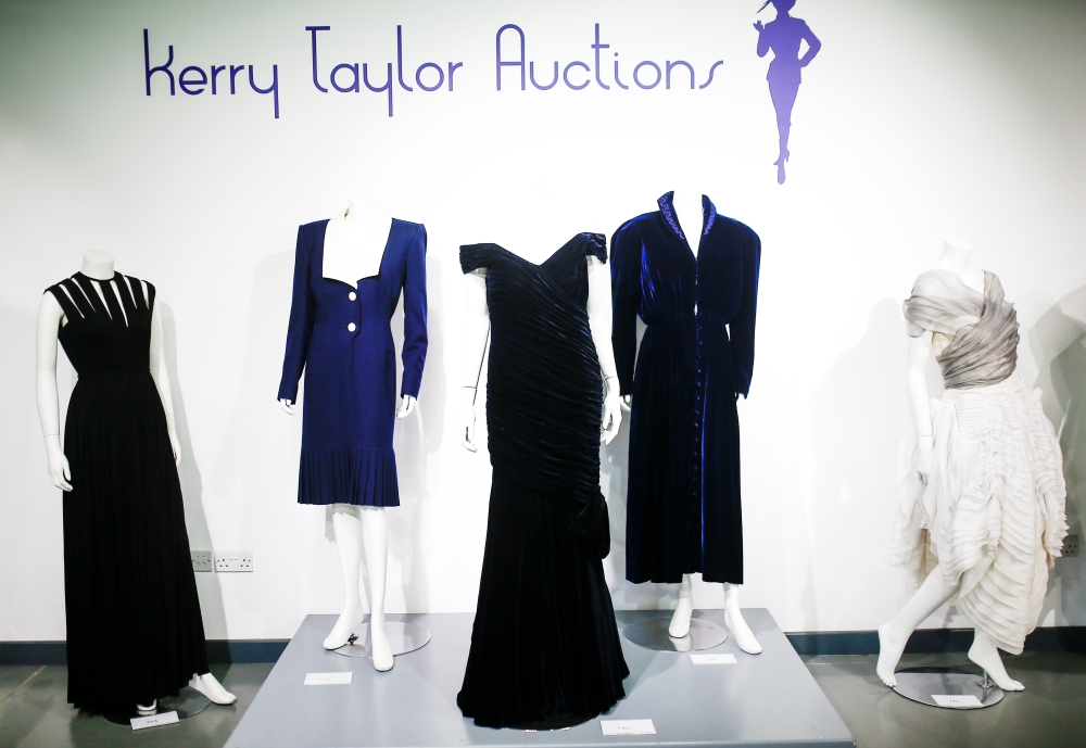 Britain's Princess Diana's Victor Edelstein midnight-blue velvet evening gown (estimated at £250,000 - £350,000), which was worn by the princess when she danced with actor John Travolta at the White House in 1985. Also pictured is her Katherine Cusack eve