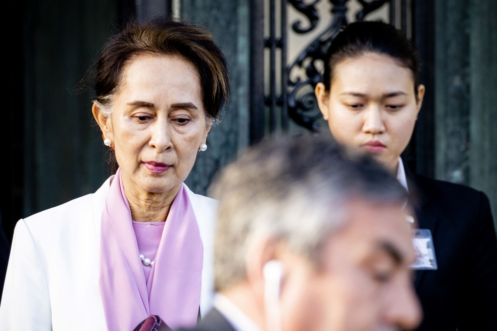 Myanmar's State Counsellor Aung San Suu Kyi leaves the Peace palace in The Hague, on December 12, 2019 on the last day of a three-day hearing on the Rohingya genocide case before the UN International Court of Justice. AFP / ANP / Sem Van Der Wal
 