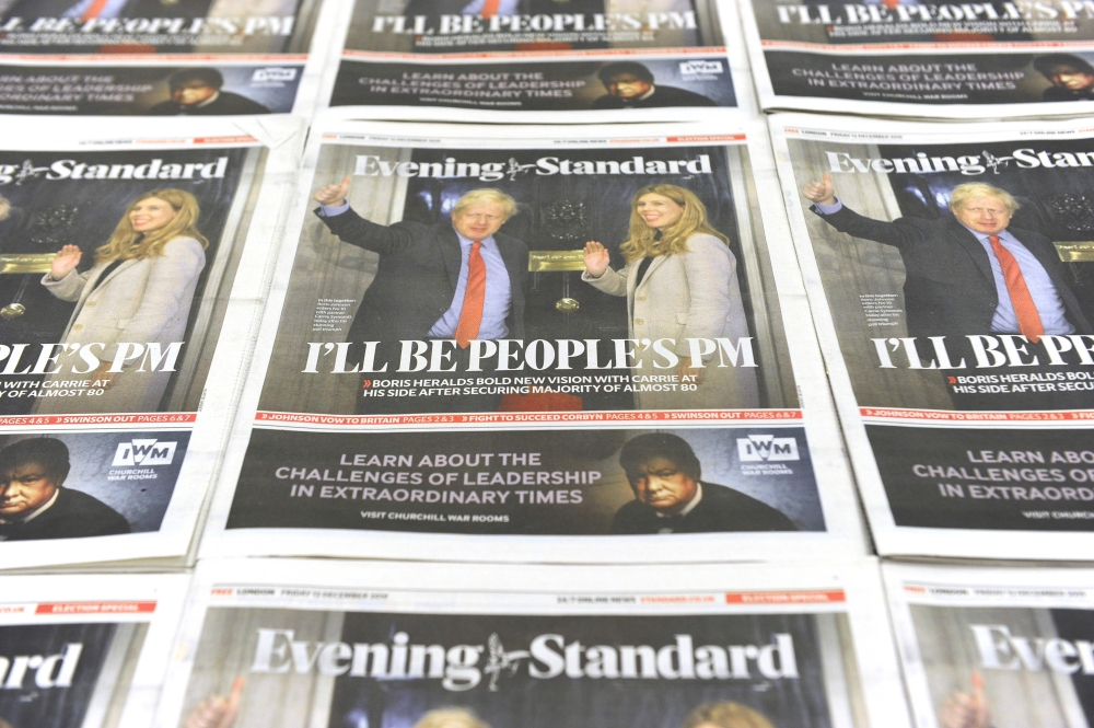 An arrangement of London Evening Standard newspapers photographed as an illustration in London on December 14, 2019, shows the front page reporting on the election victory of Prime Minister Boris Johnson's Conservative Party in the general election. AFP /