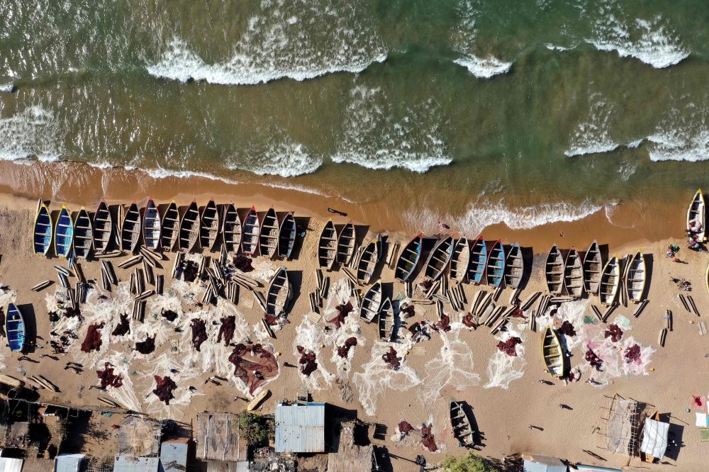An aerial view of fishing boats on the shore of the Lake Malawi at the Senga village on May 20, 2019 in Senga, Malawi. AFP / Gianluigi Guercia  