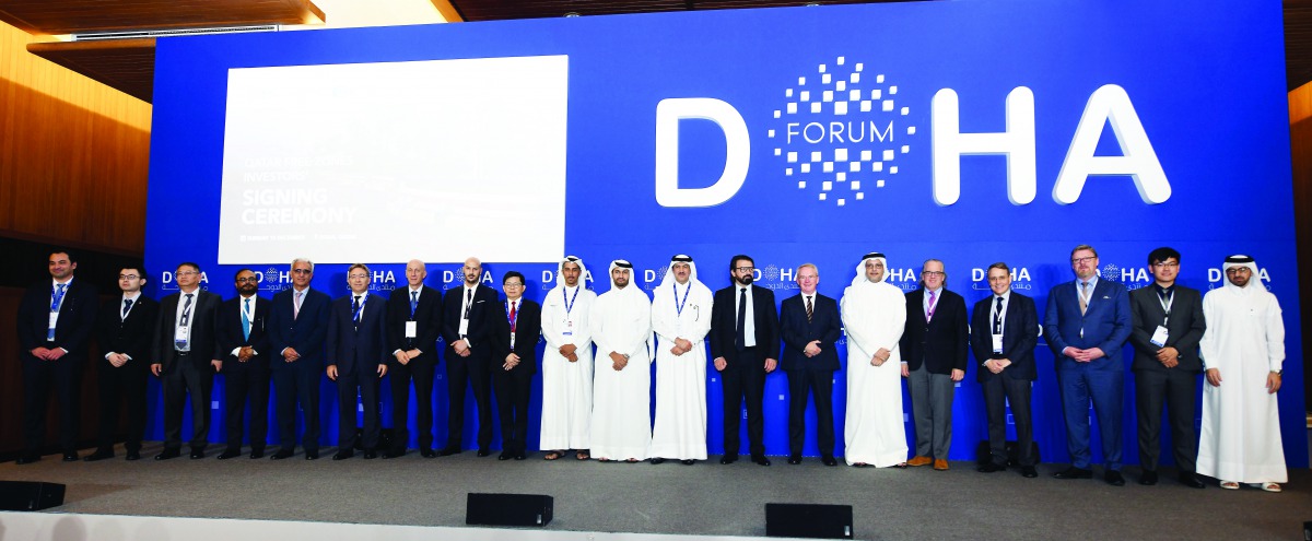 H E Ahmad bin Mohammed Al Sayed (ninth right), Minister of State and Chairman of Qatar Free Zones Authority (QFZA) with representatives of seven global companies which will operate at the Qatar Free Zones, with other officials from QFZA, Qatar Financial C