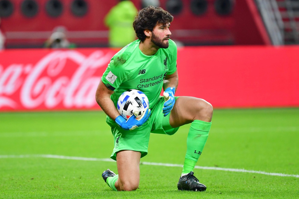 Liverpool's Brazilian goalkeeper Alisson Becker gathers the ball during the 2019 FIFA Club World Cup semi-final football match between Mexico's Monterrey and England's Liverpool at the Khalifa International Stadium in the Qatari capital Doha on December 1