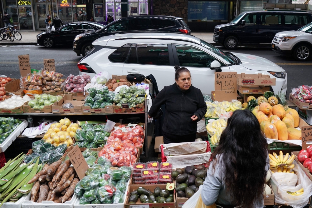Sabina Morales Hernandez sells produce at her street stand on Junction Blvd. in the Queens Borough of New York City on November 27, 2019.  AFP / Bryan R. Smith