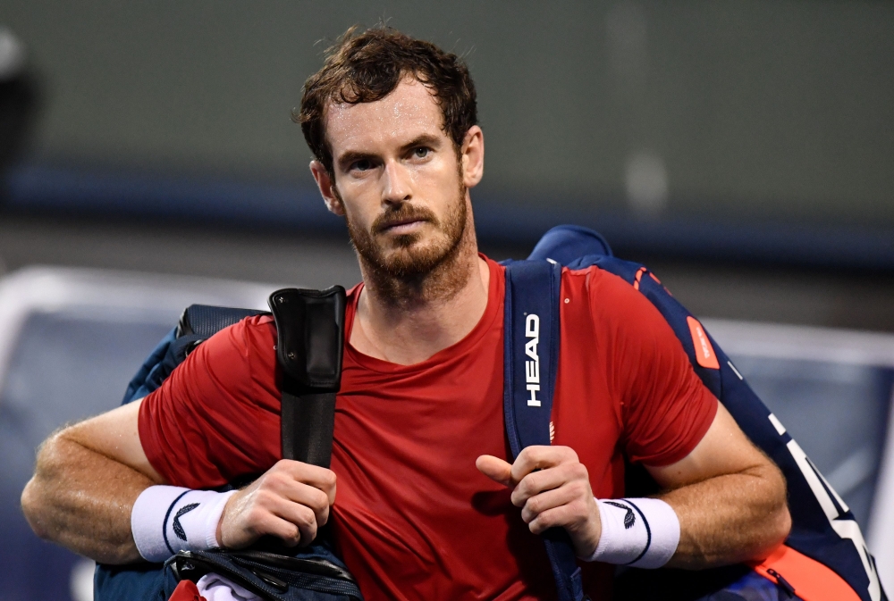 In this file photo Andy Murray of Britain leaves the court after losing against Fabio Fognini of Italy in their men's singles match at the Shanghai Masters tennis tournament in Shanghai on October 8, 2019.  / AFP / Noel CELIS 