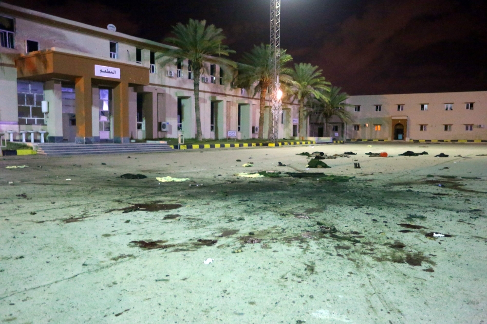 Damage on the concreate, from an air strike earlier in the day, is seen at a Military College in Al-Hadaba region in the capital Tripoli, on January 4, 2020.  AFP / Mahmud TURKIA
