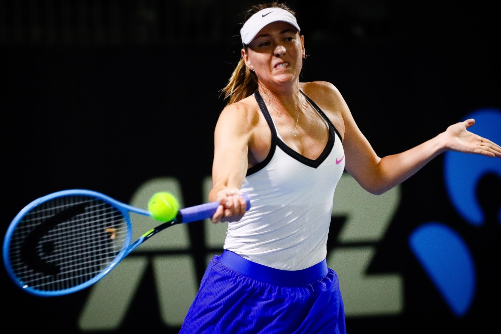 Maria sharapova of Russia hits a return to Jennifer Brady of the US during the women's singles match on day two of the Brisbane International tennis tournament in Brisbane on January 7, 2020. / AFP / AFP / Patrick HAMILTON 