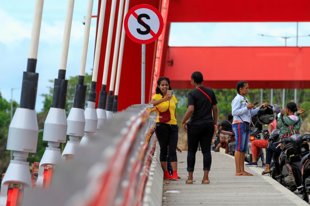 Papuan youth use smartphones in Jayapura, Papua, Indonesia, January 7, 2020. Reuters