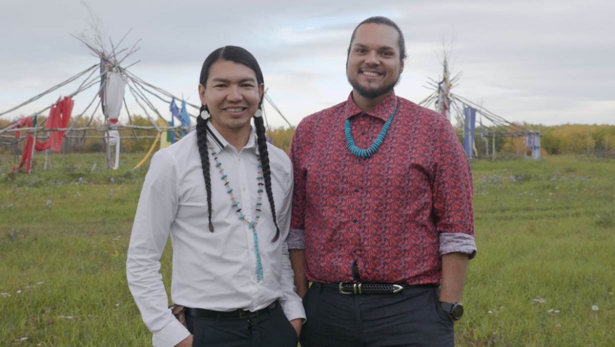Dr James Makokis with Anthony Johnson, a Navajo two-spirit community health worker, on the land where Kehewin Cree Nation hosts sacred sundance ceremonies, in Kehewin Cree Nation, Alberta, Canada, September 18, 2019. Thomson Reuters Foundation/Ryan Varga