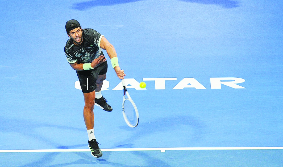 Fernando Verdasco of Spain returns the ball to Filip Krajinovic of Serbia during their pre-quarter-final match yesterday.
