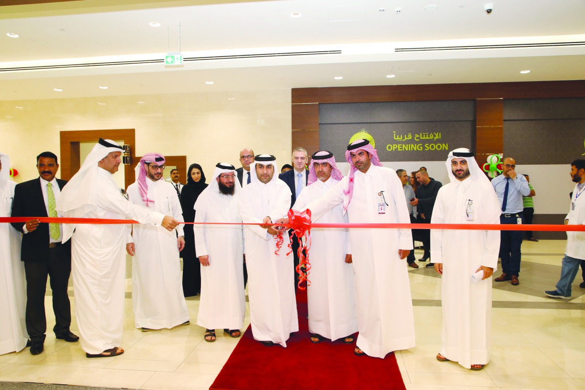 Senior officials, including top executives of Al Meera Consumer Goods Company, cutting a ribbon to mark the official opening of Al Meera’s Rawdat Al Hamama branch, yesterday. This is the 53rd shopping centre of the retail giant in Qatar.