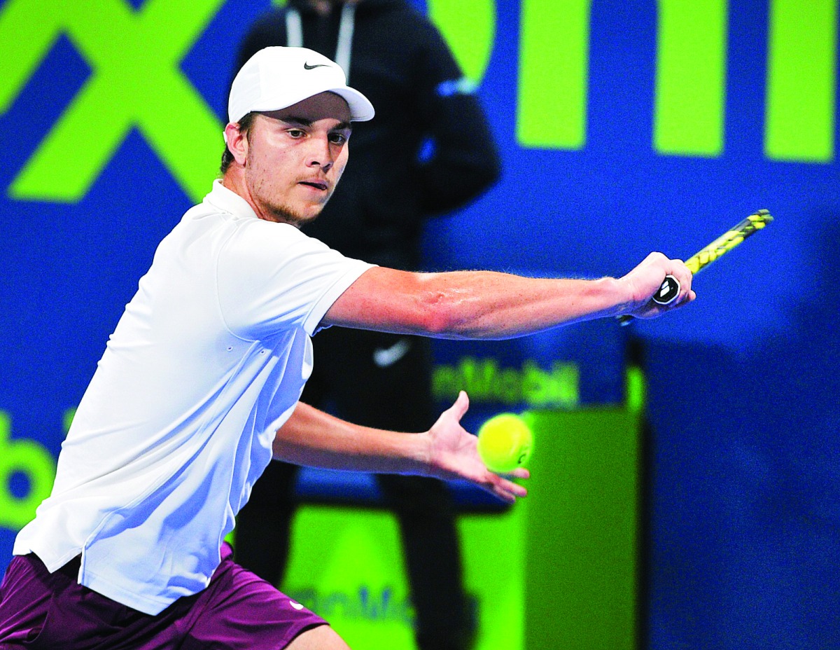 Serbian Miomir Kecmanovic returns a shot to Hungarian qualifier Marton Fucsovics during their quarter-final match of the Qatar ExxonMobil Open 2020 at the Khalifa International Tennis and Squash Complex in Doha yesterday. Pic: Salim Matramkot / The Penins