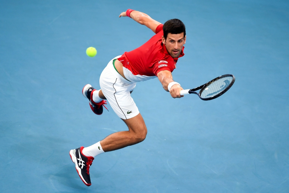  Novak Djokovic of Serbia hits a return in his men's singles match against Denis Shapovalov of Canada at the ATP Cup tennis tournament in Sydney on January 10, 2020. -- I
/ AFP / William WEST /