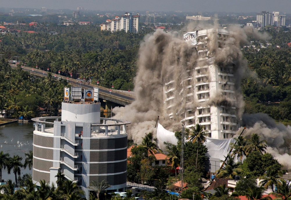 A high-rise residential building is demolished with controlled blasting which, according to authorities, was built in violation of the Coastal Regulation Zone (CRZ) norms, in Kochi, India, January 11, 2020. REUTERS/Sivaram V