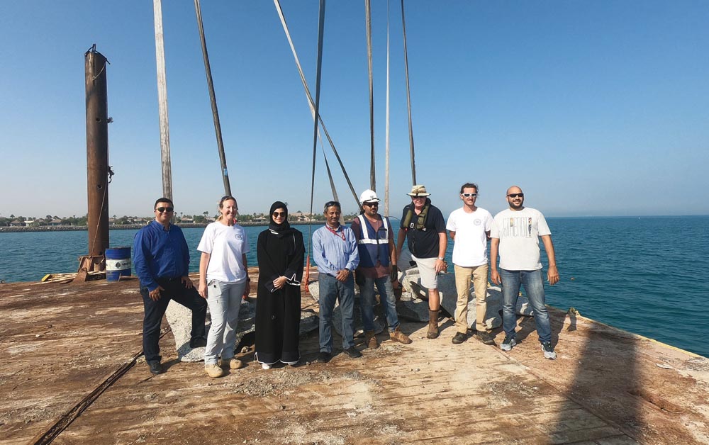 Qatargas officials during an installation of the artificial coral ridge modules.