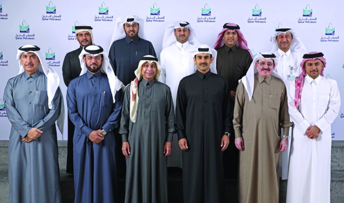 H E Saad Sherida Al Kaabi (third right, front), the Minister of State for Energy Affairs, the President and CEO of Qatar Petroleum; Issa Shahin Al Ghanim (third left, front) with QP officials during the farewell event.