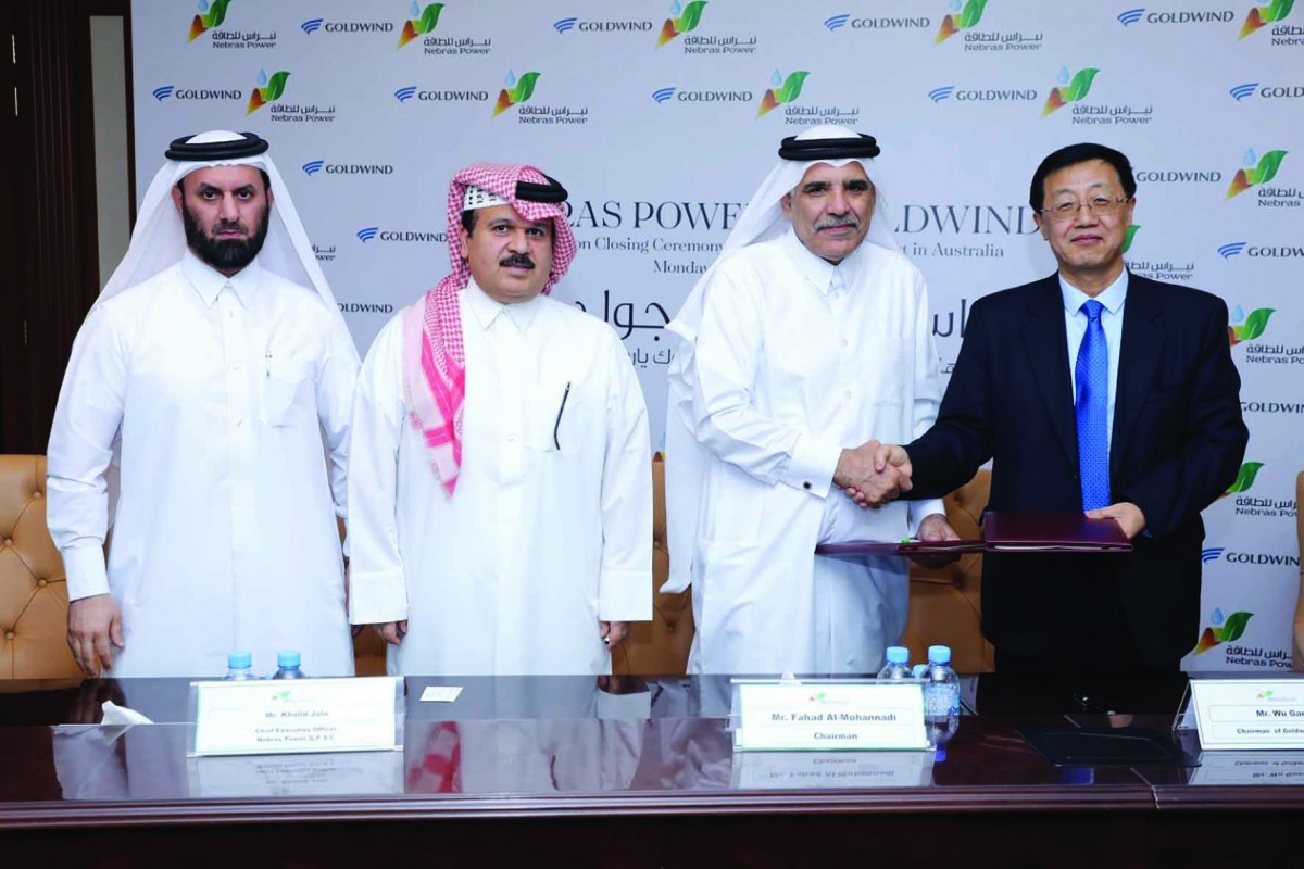 Fahad Hamad Al Mohannadi (second right), Chairman of the Board of Nebras; Khalid Mohammed Jolo (second left), Chief Executive Officer of Nebras; and other officials during the signing ceremony.
