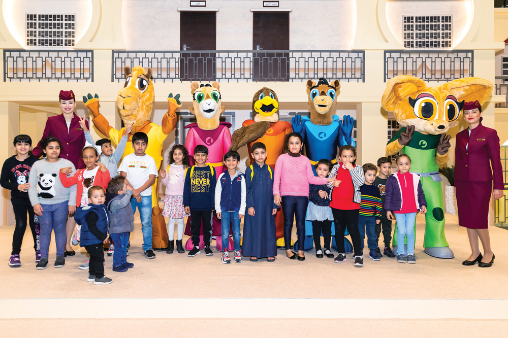 Children with Qatar Airways’ cabin crew and Oryx Kids Club mascots at the book fair.