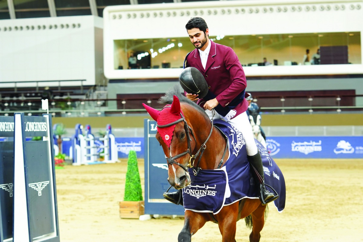 Nasser Al Ghazali riding What A Pleasure to the victory ceremony during the Medium Tour at Hathab Series Round Six at the Al Shaqab Arena yesterday.
