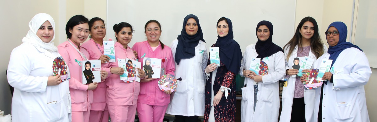 Healthcare professionals during Qatar Cancer Society's campaign to raise awareness about cervical cancer. 
