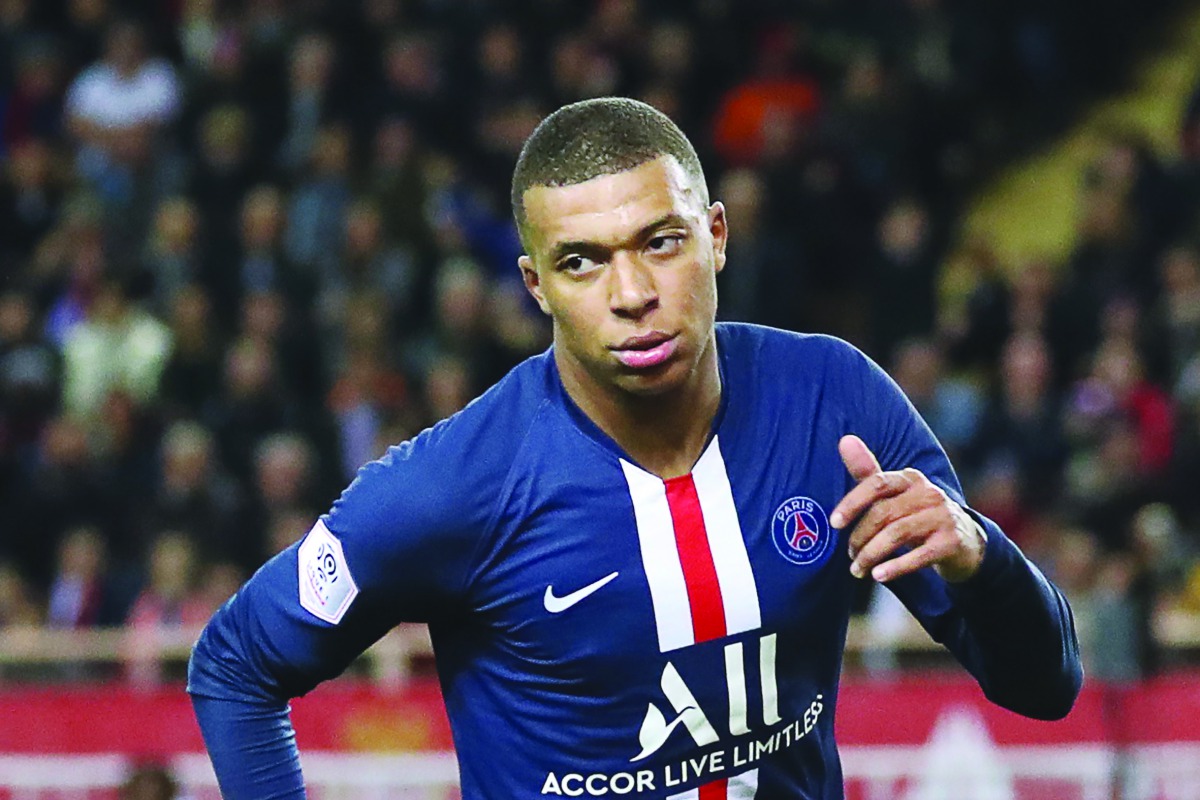 Paris Saint-Germain's French forward Kylian Mbappe celebrates after scoring a goal during the French L1 football match between Monaco (ASM) and Paris Saint-Germain (PSG) at the Louis II Stadium in Monaco on January 15, 2020. AFP / Valery Hache
