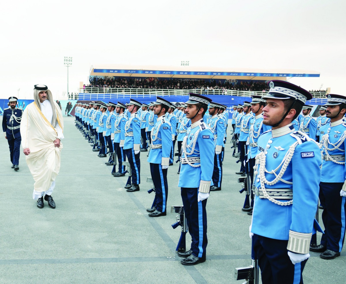 Amir H H Sheikh Tamim bin Hamad Al Thani reviewing the queue of 110 new graduates.
