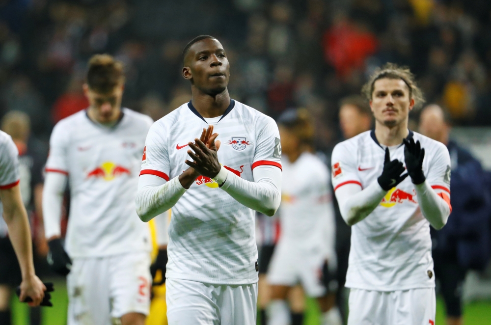 RB Leipzig's Nordi Mukiele applauds fans after the match REUTERS/Ralph Orlowski 