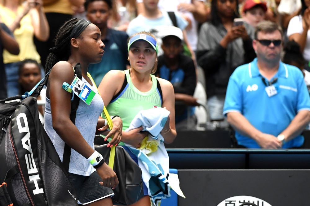 Coco Gauff of the US walks off the court after losing against Sofia Kenin of the US during their women's singles match on day seven of the Australian Open tennis tournament in Melbourne on January 26, 2020./ AFP / John DONEGAN 