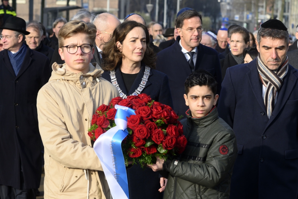 Prime Minister Mark Rutte and mayor Femke Halsema attend a silent march to the 