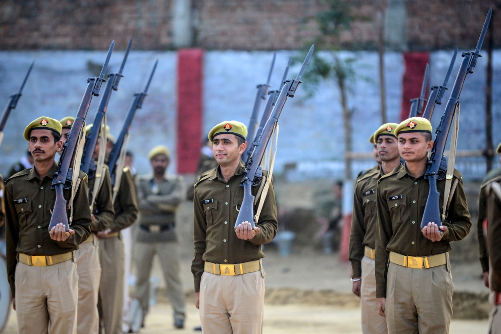 Uttar Pradesh police personnel in Allahabad take part in Republic Day parade rehearsal holding Lee-Enfield .303 rifles, on January 22, 2020, which are decommissionned on Republic Day on January 26 following an order from Uttar Pradesh police headquarters.