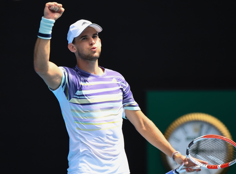 Austria's Dominic Thiem celebrates after beating France's Gael Monfils during their men's singles match on day eight of the Australian Open tennis tournament in Melbourne on January 27, 2020. AFP / William West 