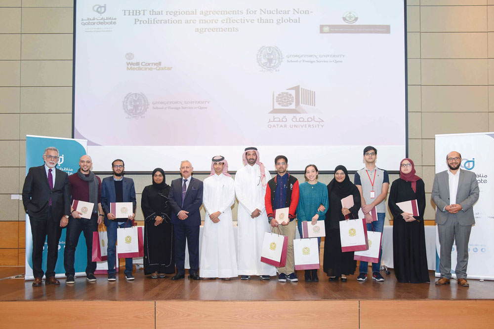 Participants of the third Qatar Universities Debate League pose for a group photo.