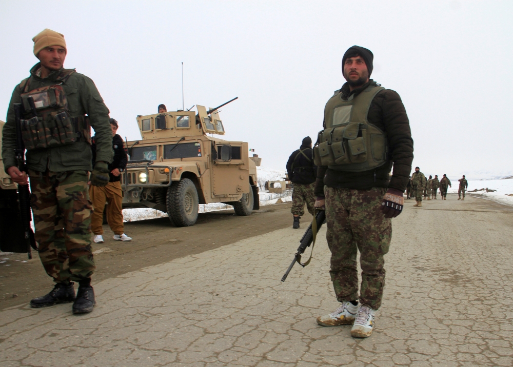 Afghan National Army forces go towards the site of an airplane crash in Deh Yak district of Ghazni province, Afghanistan January 27, 2020. REUTERS/Mustafa Andaleb