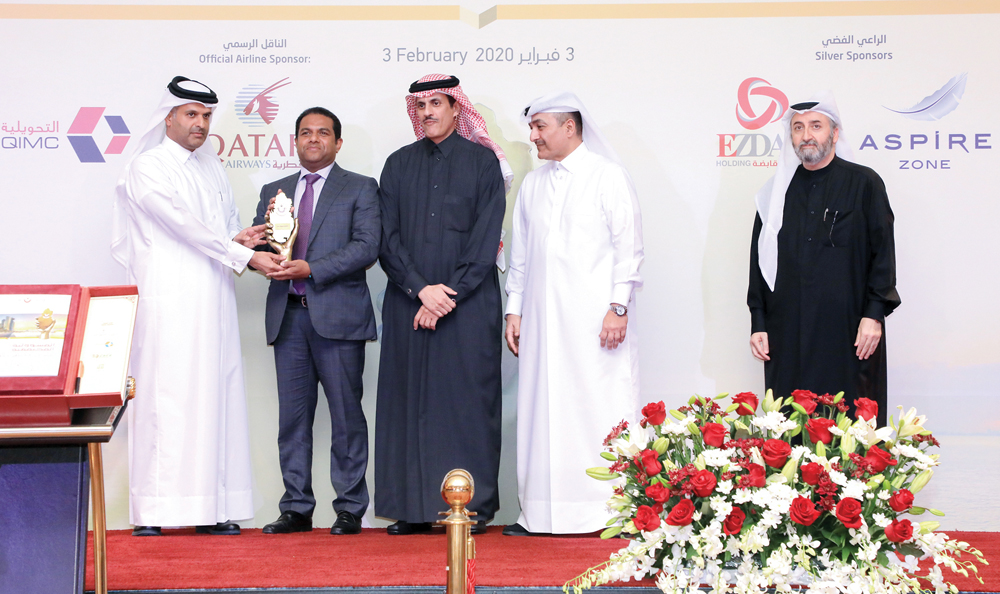 Minister of Administrative Development, Labour and Social Affairs, H E Yousef bin Mohammed Al Othman Fakhro (second right); Sheikh Dr. Khalid bin Thani bin Abdullah Al Thani (centre), Vice-Chairman of the Board of Directors of Dar Al Sharq Group, attendin