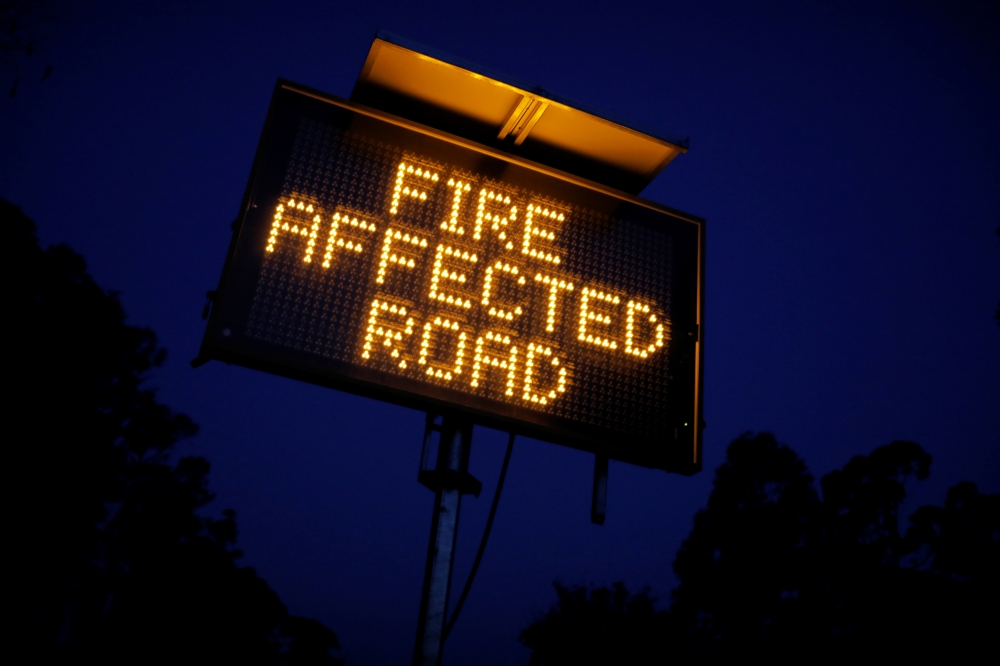  Signage is seen on the bushfire affected Bruthen-Buchan Road near Buchan, Victoria, australia, January 25, 2020. REUTERS/Andrew Kelly 