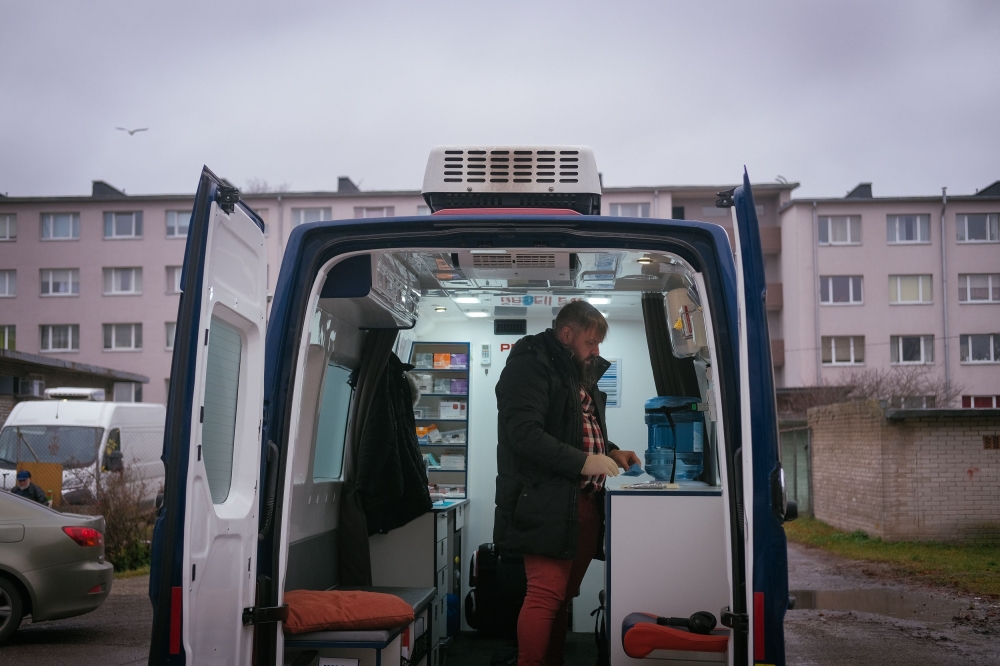 Jaan Vaart, former drug user and nowadays coordinator of the harm reduction service, poses for a picture inside a van equipped with syringes and emergency equipment that he uses in his daily job, in Tallinn on November 18, 2019. AFP / Alessandro Rampazzo